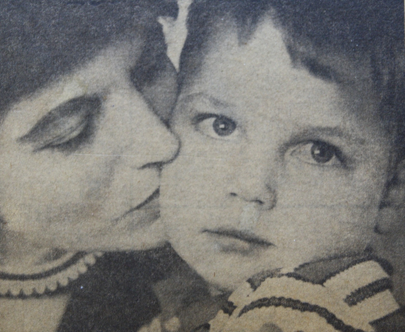 Black-and-white close-up photograph of a woman and a child.