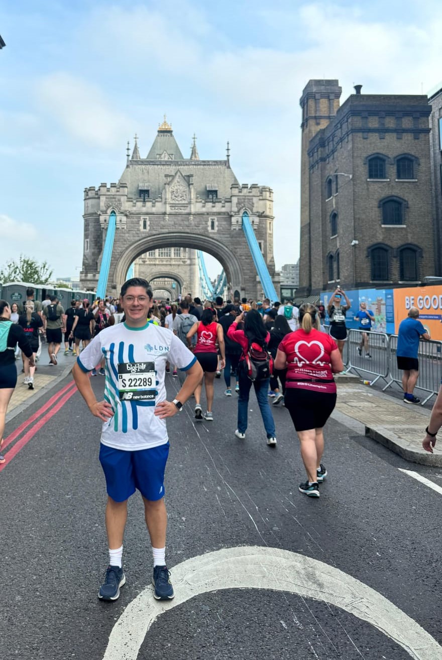 Runner standing on the road near Tower Bridge during the Big Half marathon.