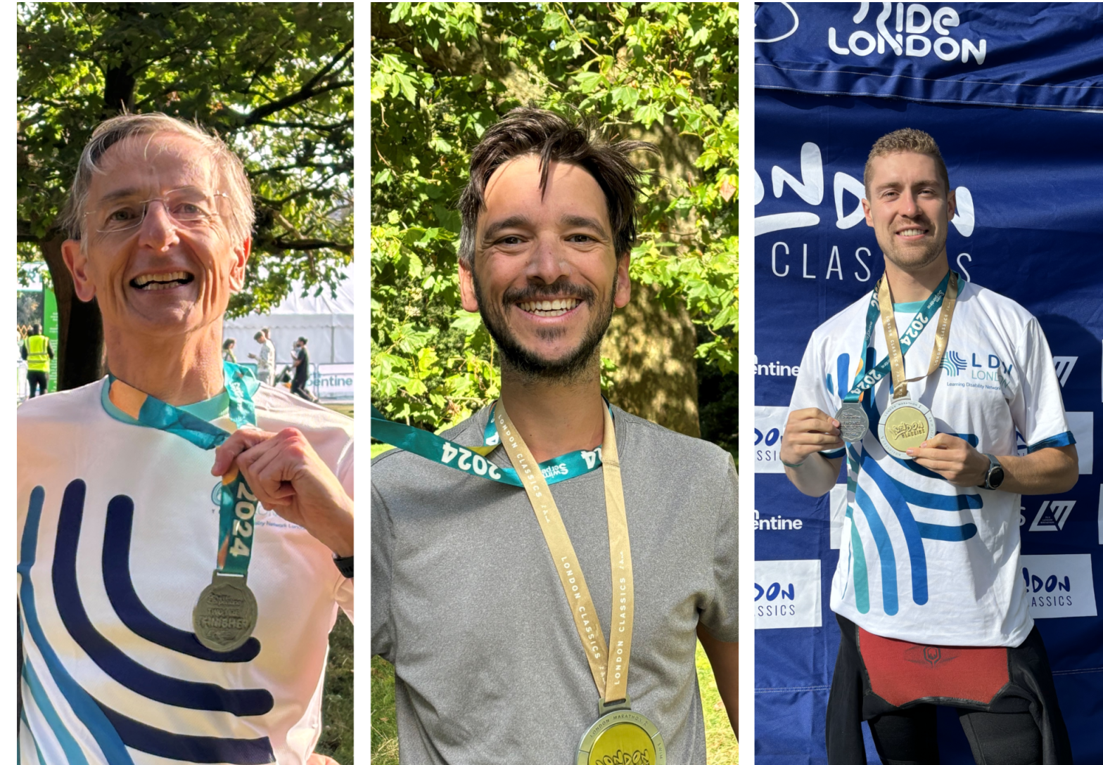Three swimmers smiling and holding medals after a running event.