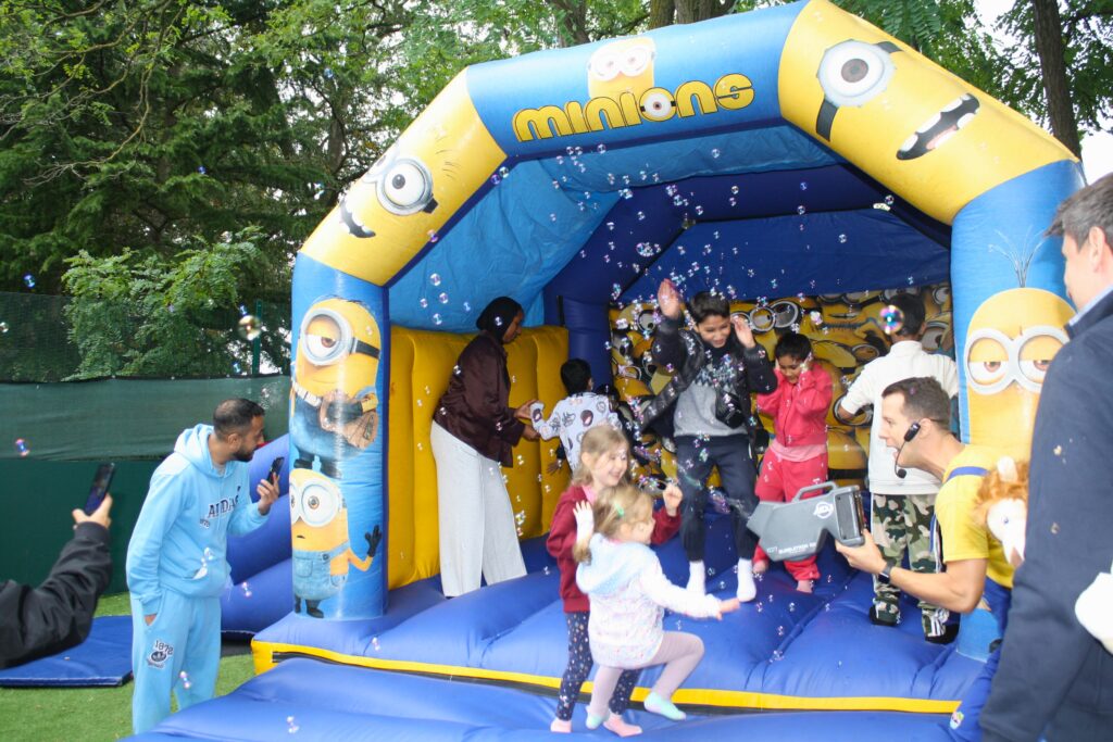children having fun on a bouncy castle
