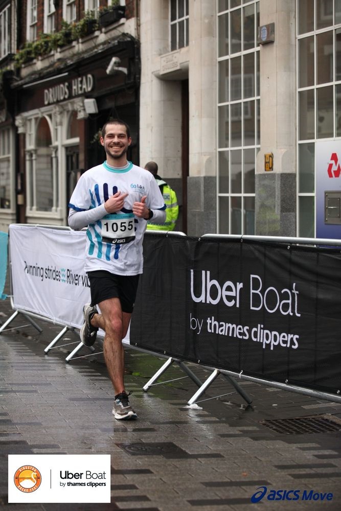 Runner wearing a race number participating in a city running event.