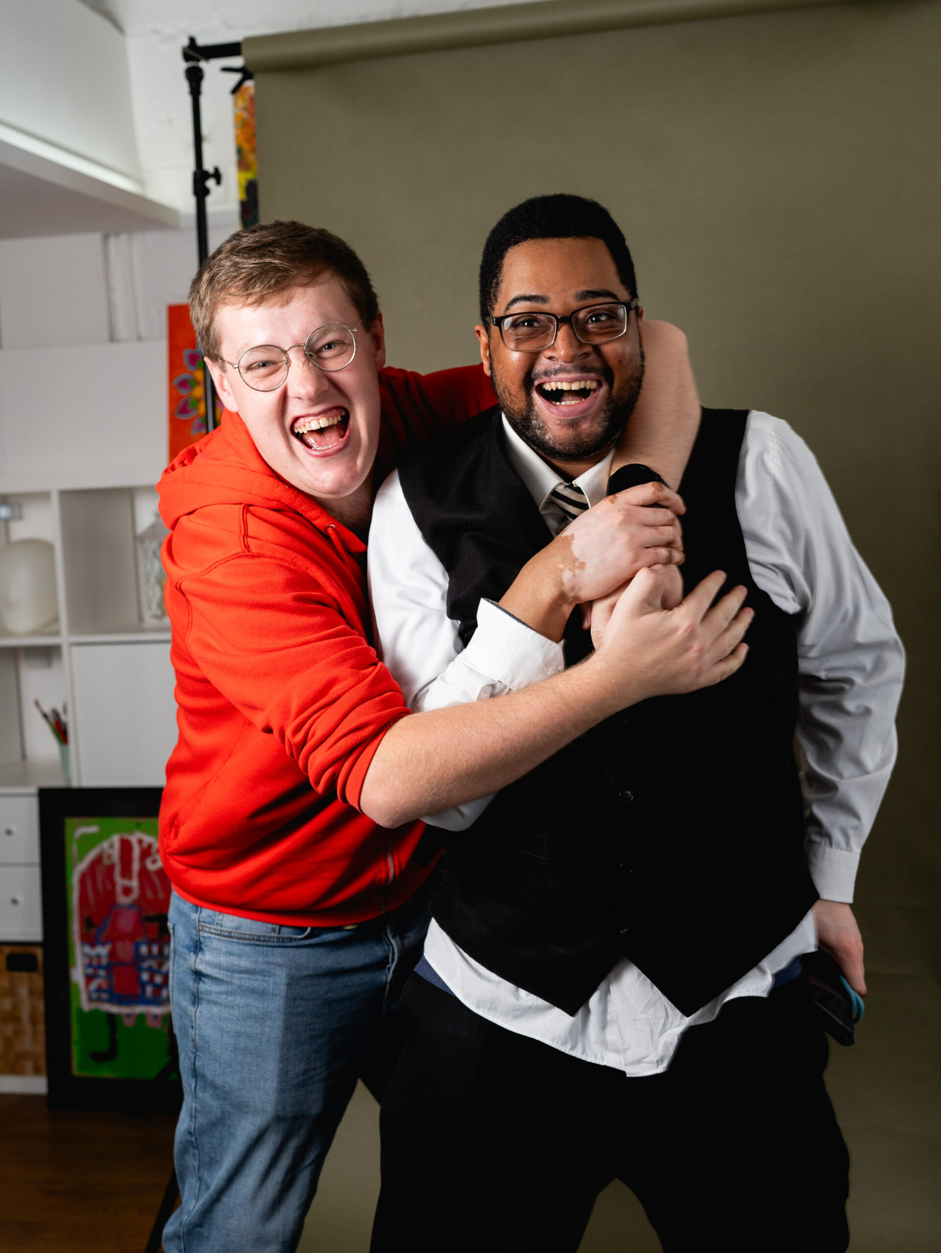 Two men laughing and having their picture taken