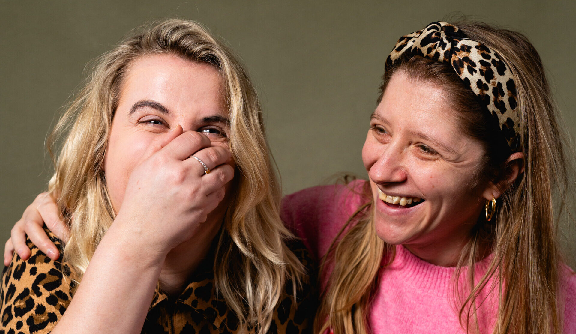 Two people hugging and laughing