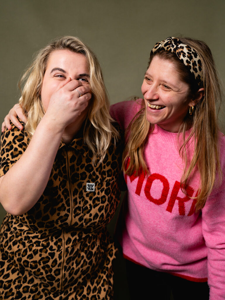 Two people hugging and laughing