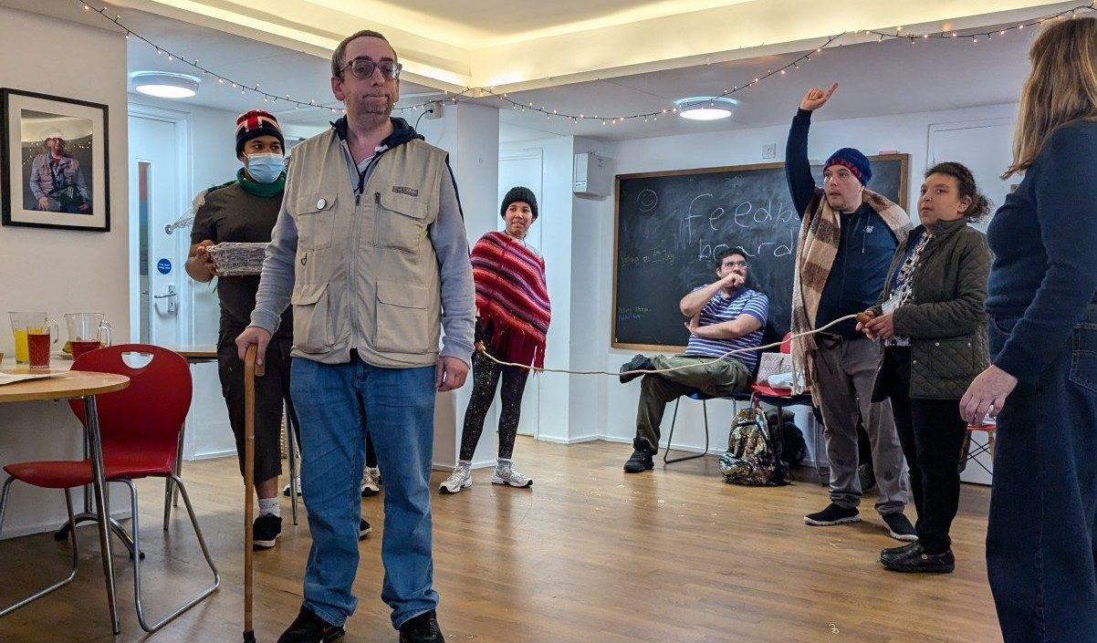 A group of people rehearsing a play