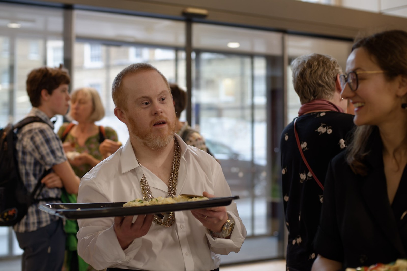 A man serving food on a platter