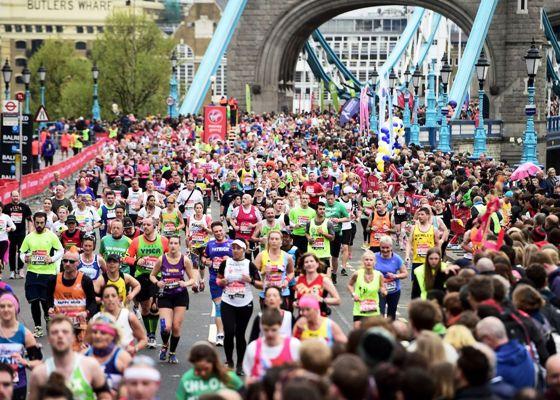 Large crowd of runners crossing Tower Bridge during the Big Half marathon.